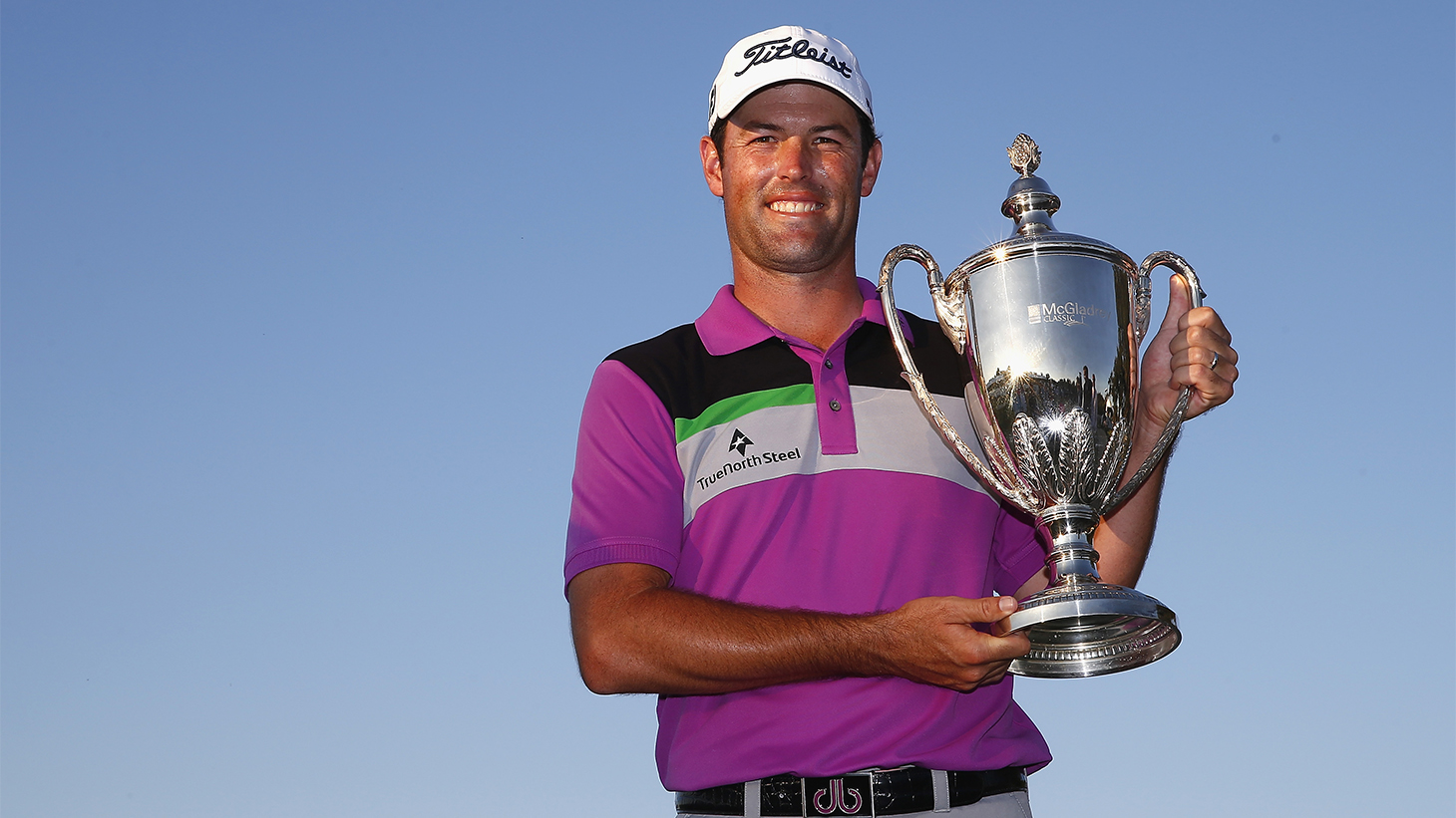 Robert Streb poses with the trophy after winning...