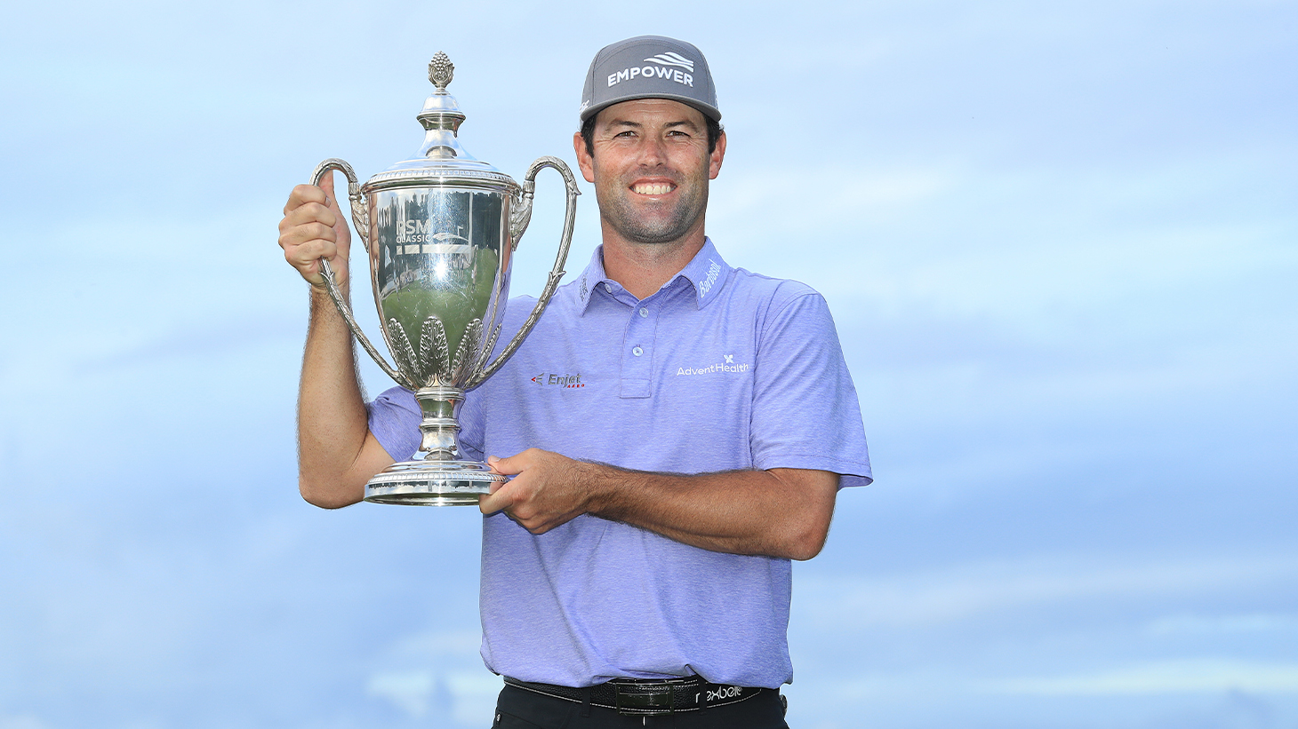 Robert Streb celebrates with the trophy after...