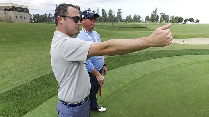 Chris helps Team Titleist member Kyle. 