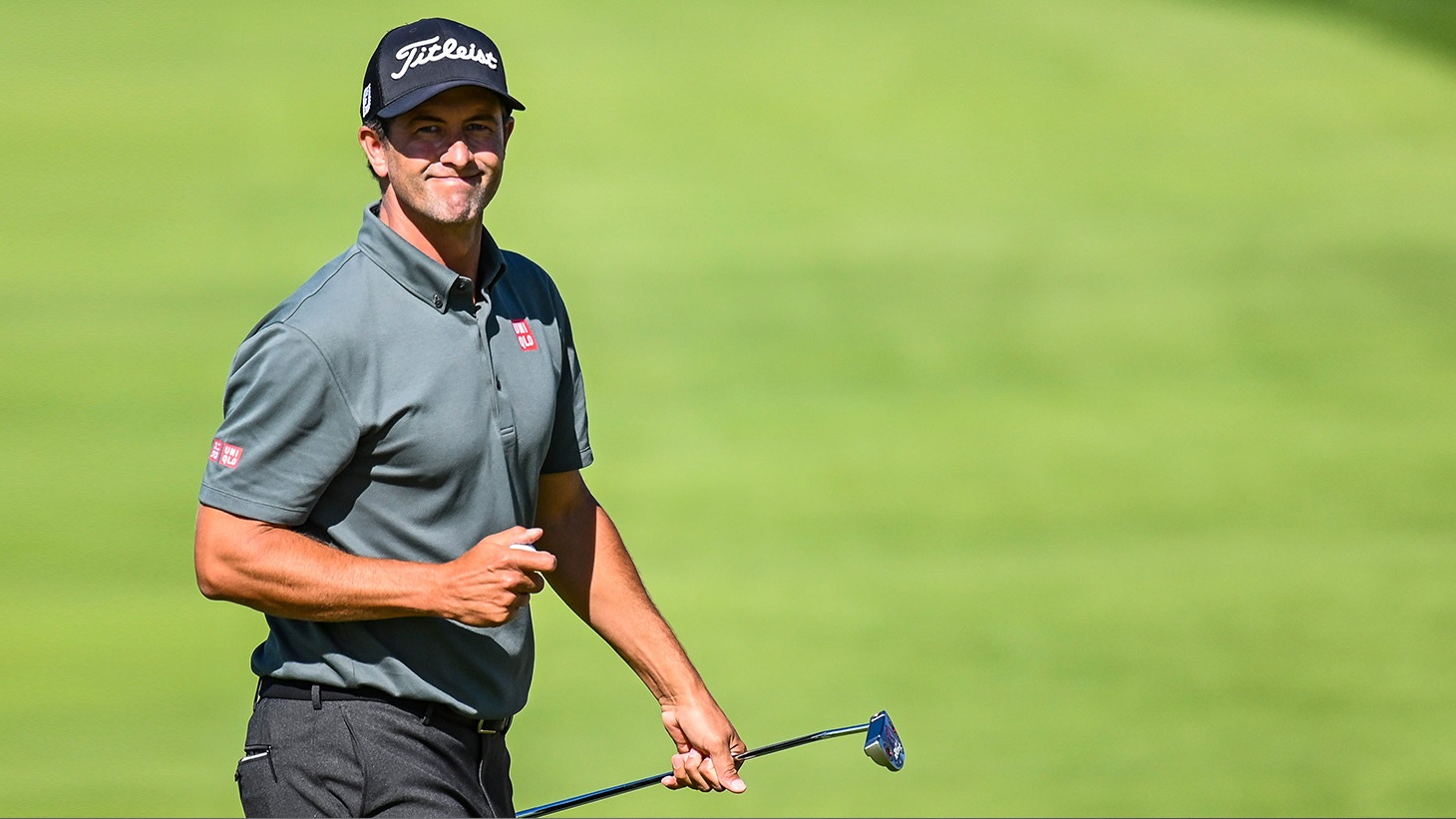 Adam Scott smiles after holing a birdie putt during action at the 2019 PLAYERS Championship