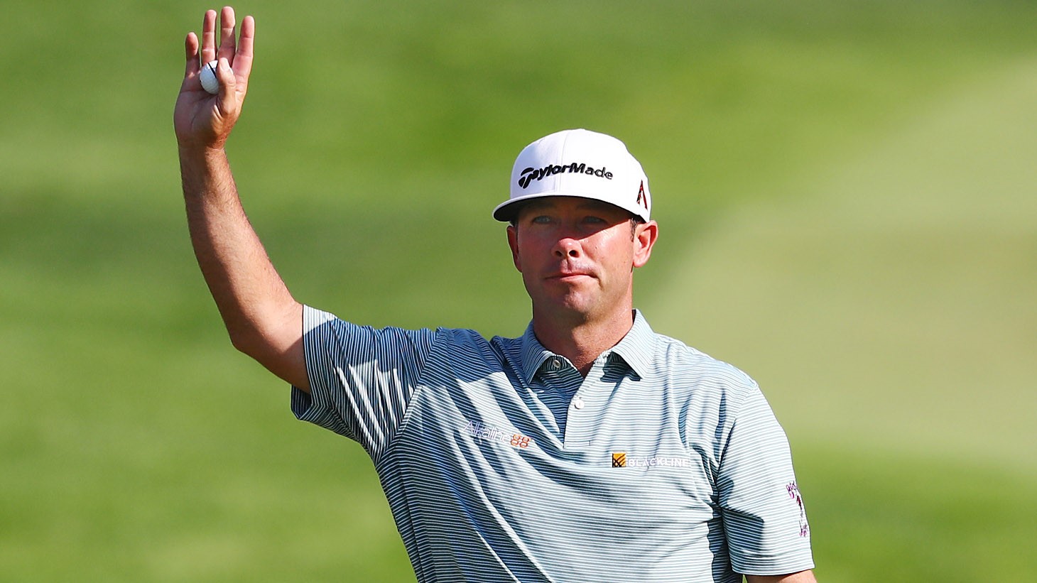 Chez Reavie raises his Pro V1 golf ball after sinking his winning putt at the 2019 Travelers Championship, the 100th victory this season for Titleist golf ball players.