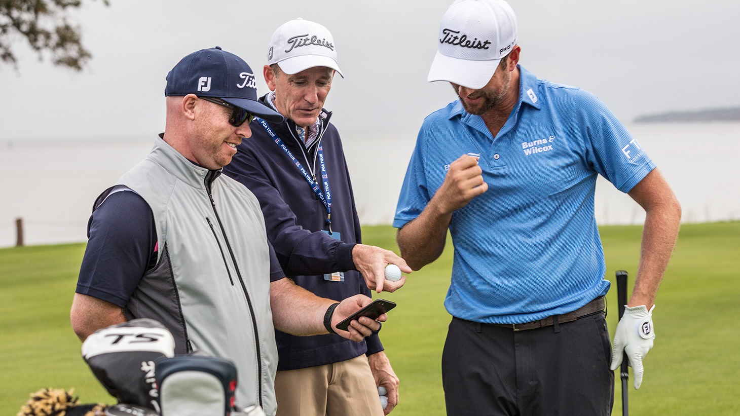 JJ Van Wiesenbeeck, Fordie Pitts and Webb Simpson discuss launch data during a golf ball fitting session at the 2019 RSM Classic